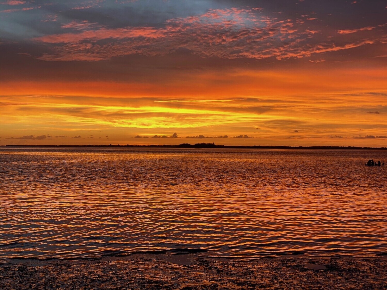 Golden sunset with reflection over Sanibel Island.