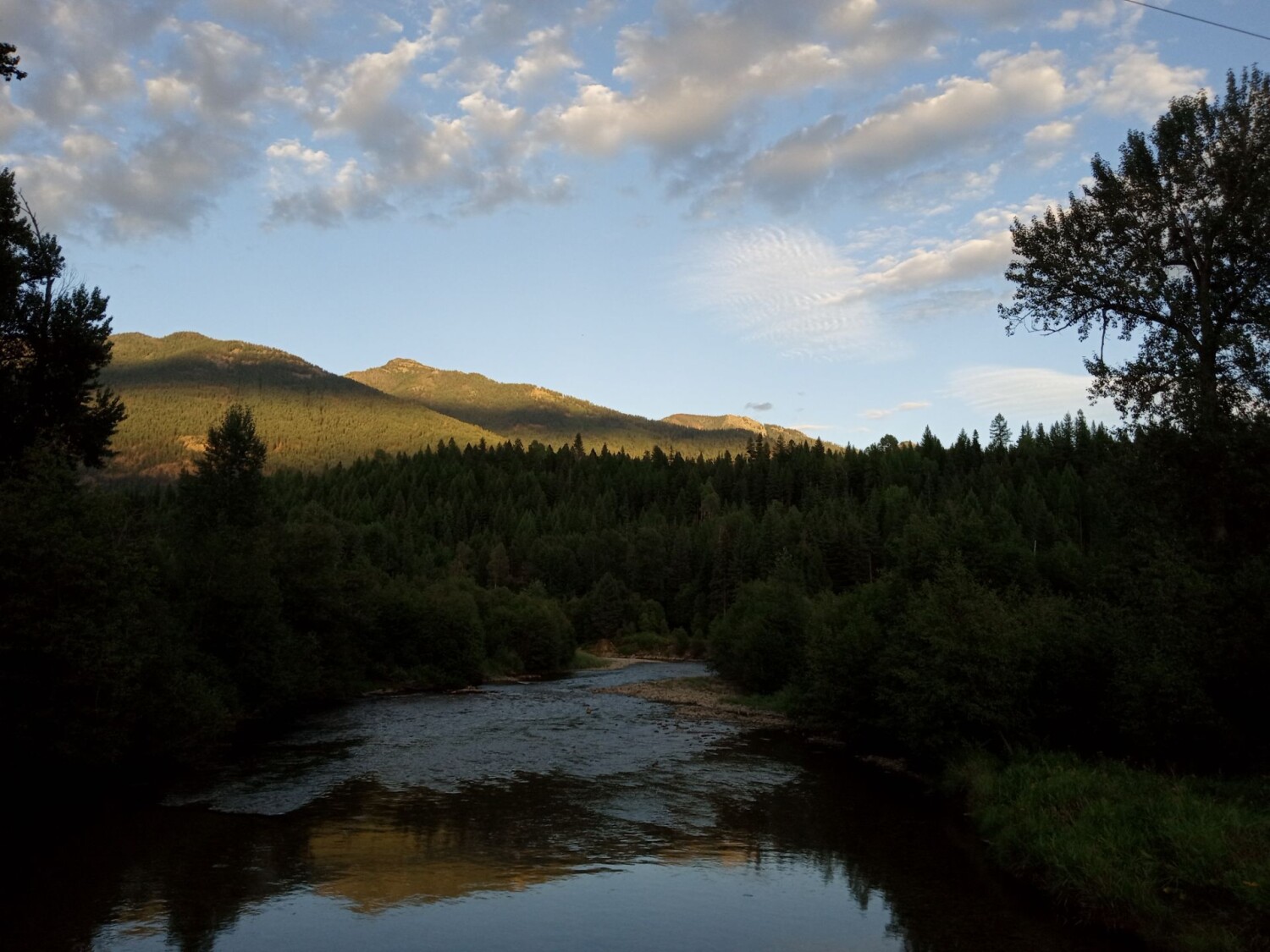 Creek and shaded mountains