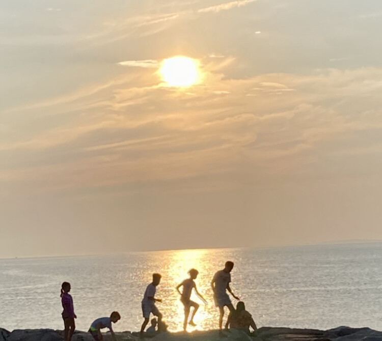 Boys on the breakwater wall ..