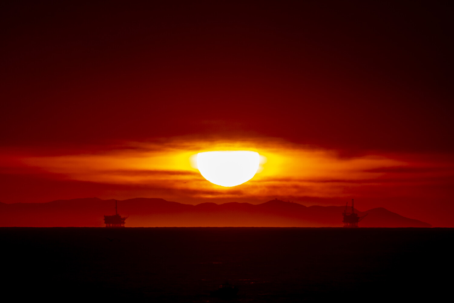 Sunrise and Oil Platforms