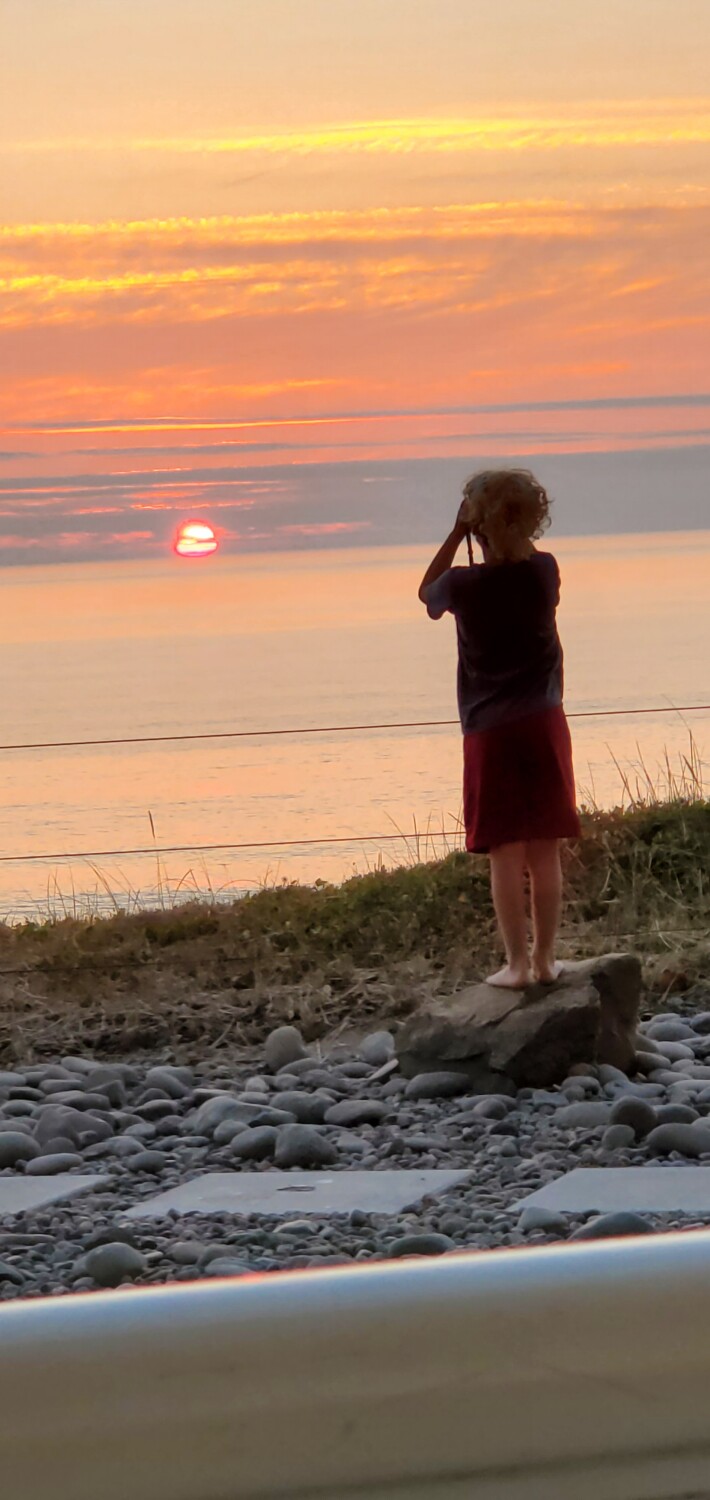 Boy and Pacific Coast Sunset