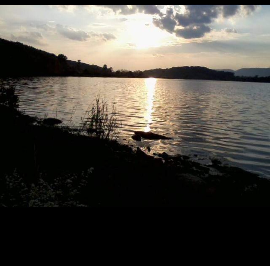 Sun setting on the water