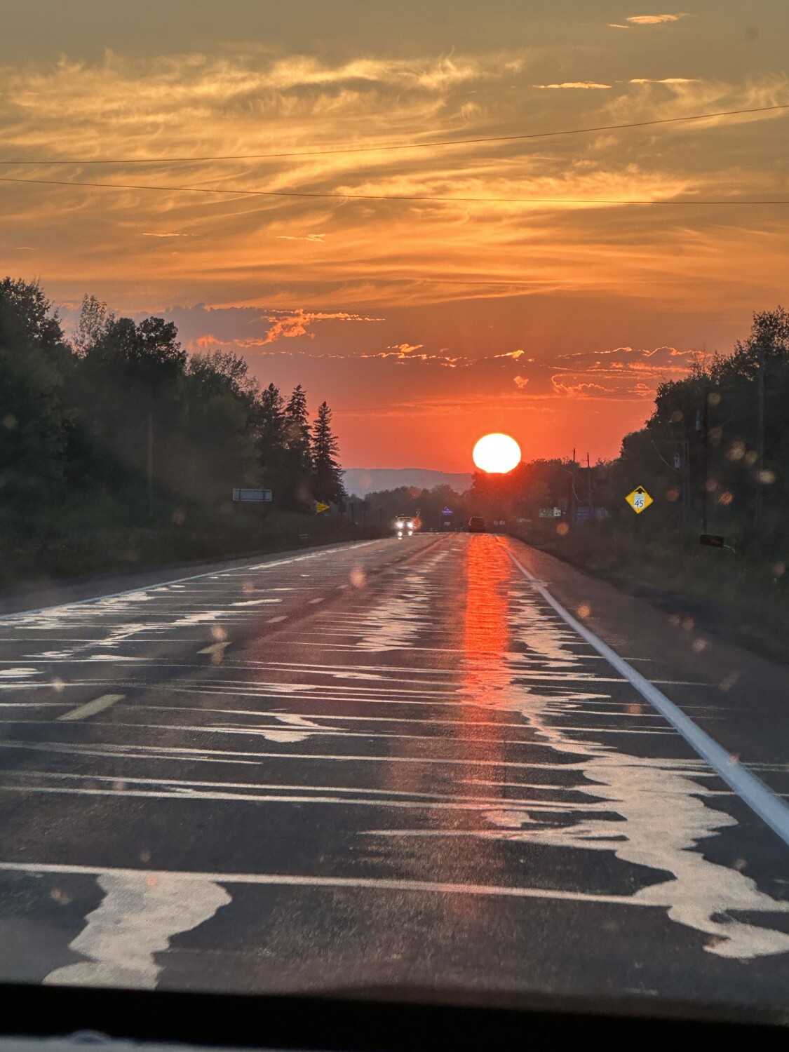 Wisconsin sunset on the road.
