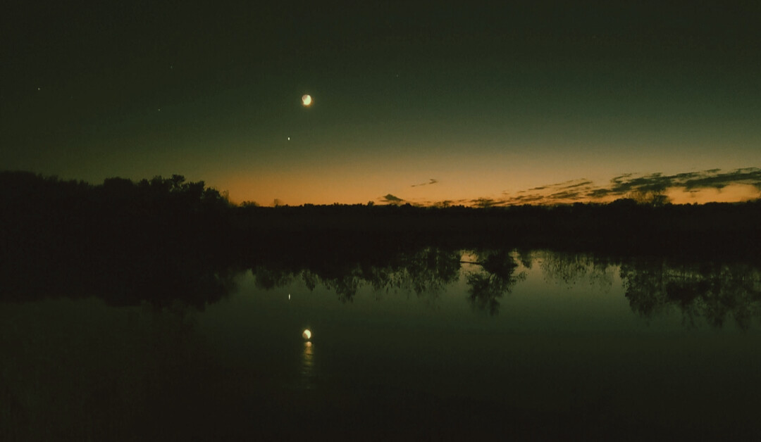 Iowa sunset through the moon & stars