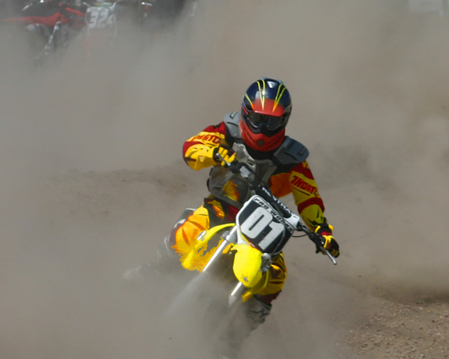 Grandson creating dust storm in the berm!