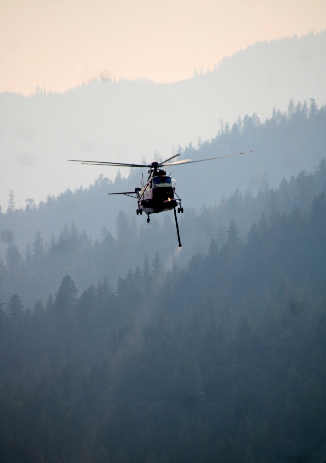 Fire Helicopter Over Mountain Range.